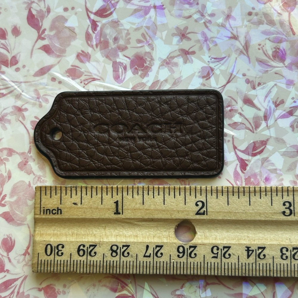 COACH Brown Pebbled Leather Tag